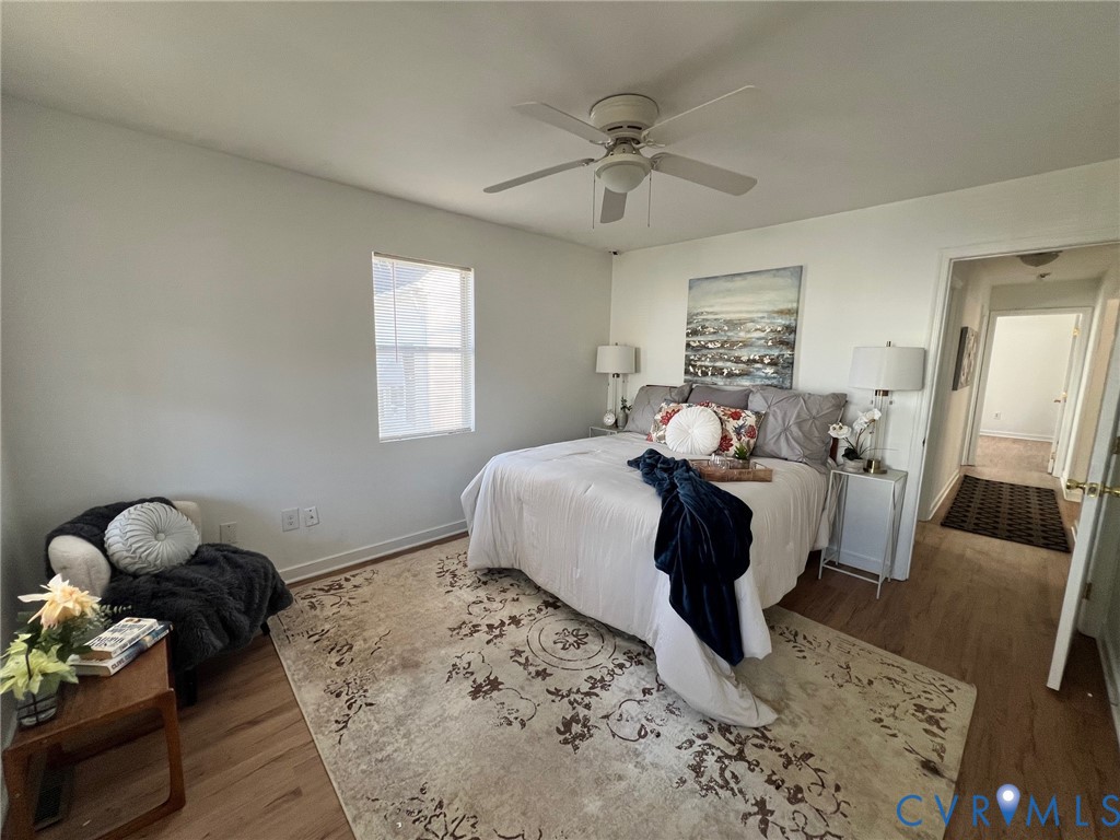 2604 Perry Street Richmond, VA 23225 - Photo 16 of 30 a bedroom with a bed mirror and couch