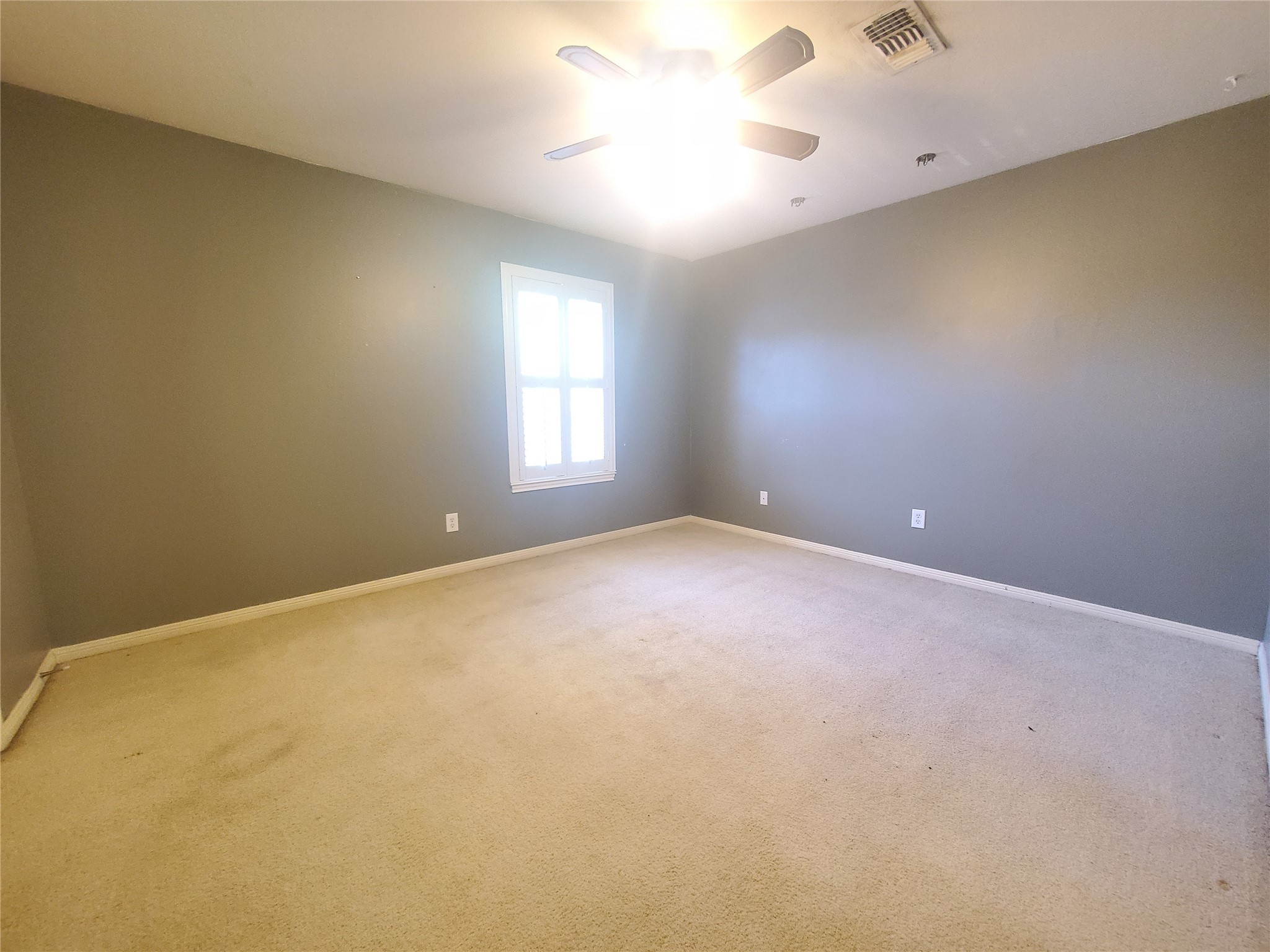 2030 Plantation Drive, Unit B2 Conroe, TX 77301 - Photo 14 of 20 a view of an empty room with a window