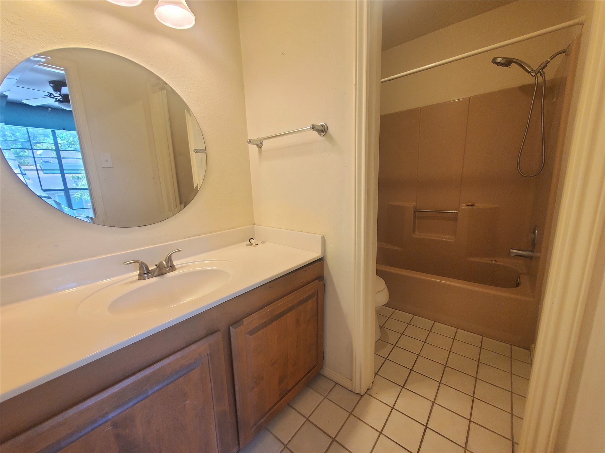 2030 Plantation Drive, Unit B2 Conroe, TX 77301 - Photo 18 of 20 a bathroom with a sink a toilet and shower