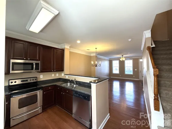 a kitchen with a stove and a microwave