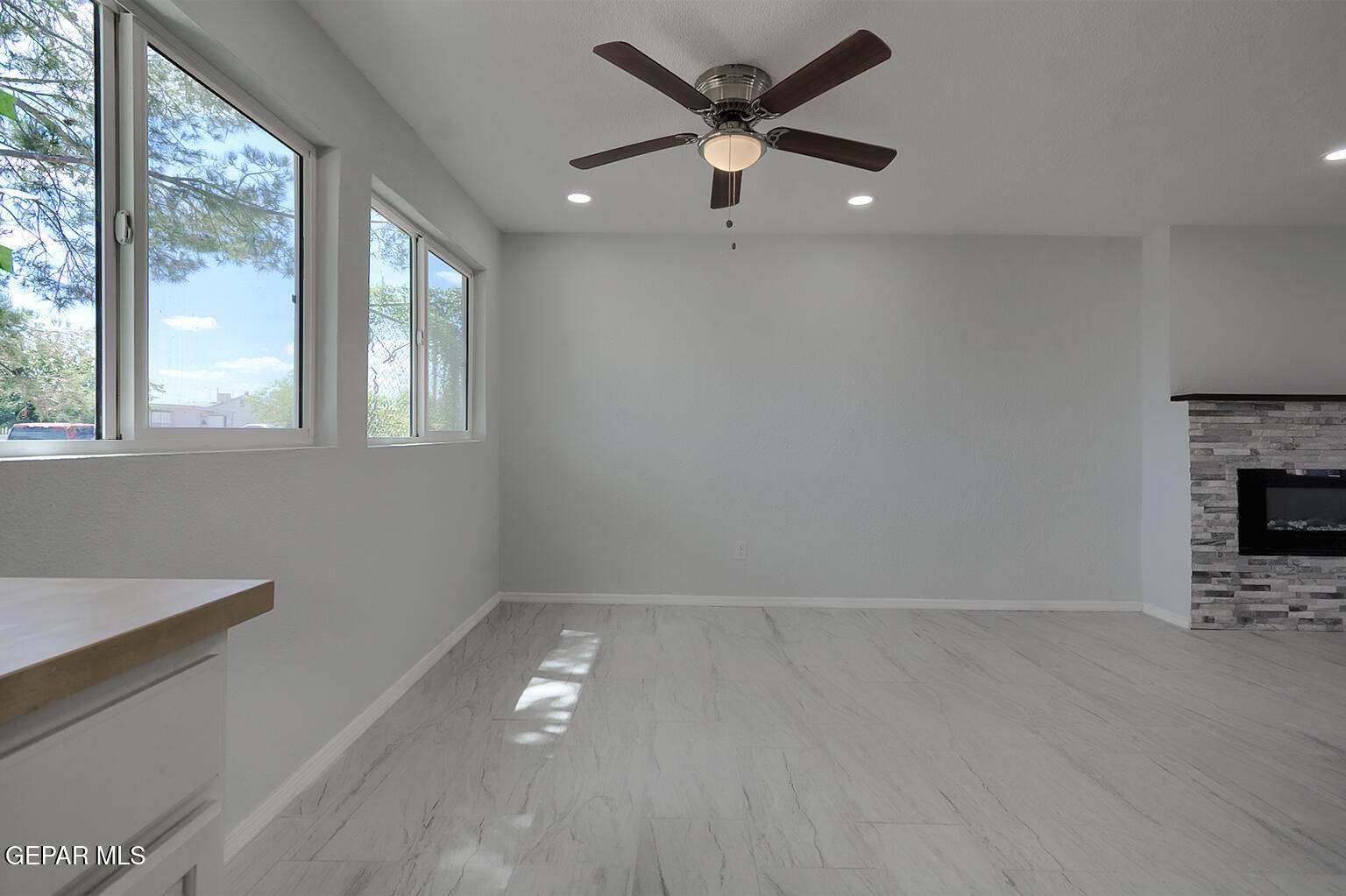 6247 Arapaho Road El Paso, TX 79905 - Photo 16 of 43 wooden floor in an empty room with a window