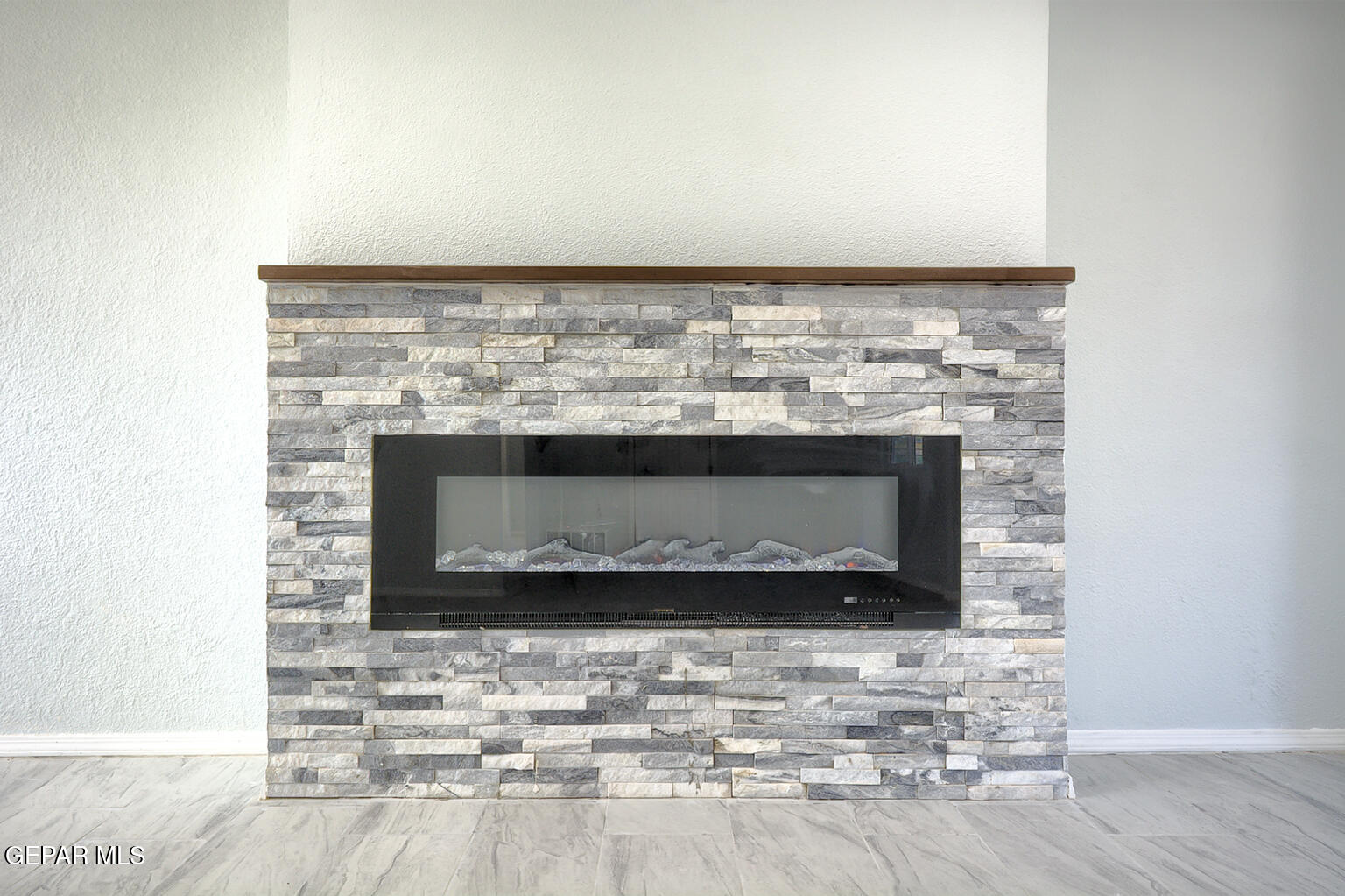 6247 Arapaho Road El Paso, TX 79905 - Photo 17 of 43 a room with a fireplace