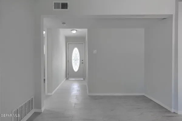 a view of empty room with windows