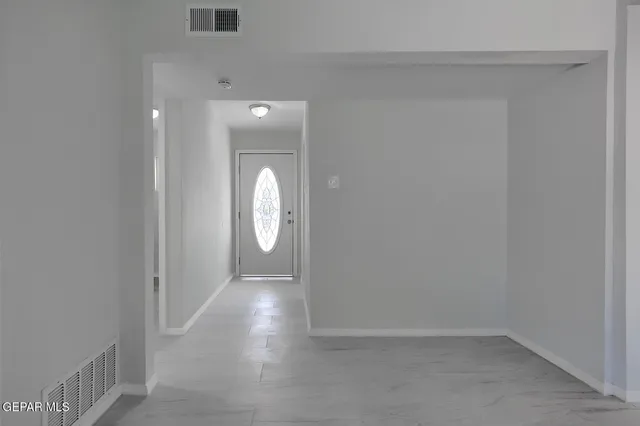 a view of empty room with windows