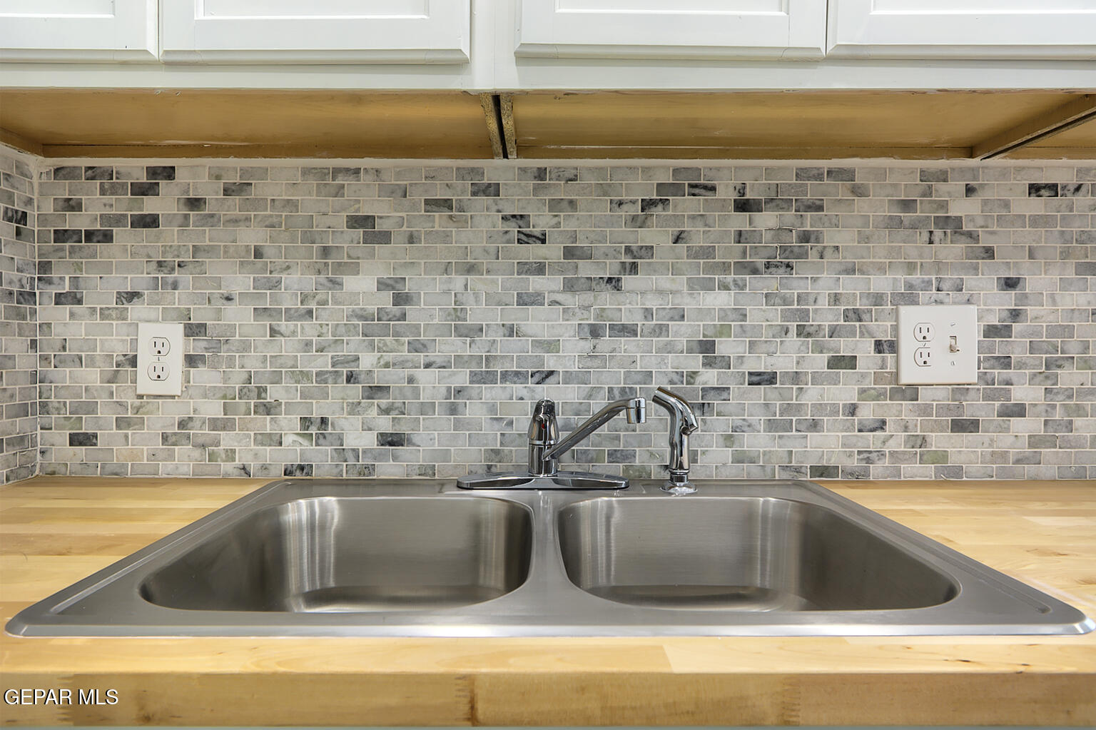 6247 Arapaho Road El Paso, TX 79905 - Photo 25 of 43 a view closed kitchen island a sink a counter space and a stove top oven