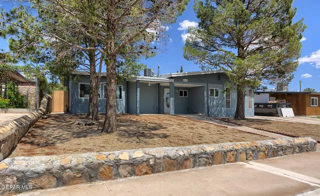 a house with trees in front of it