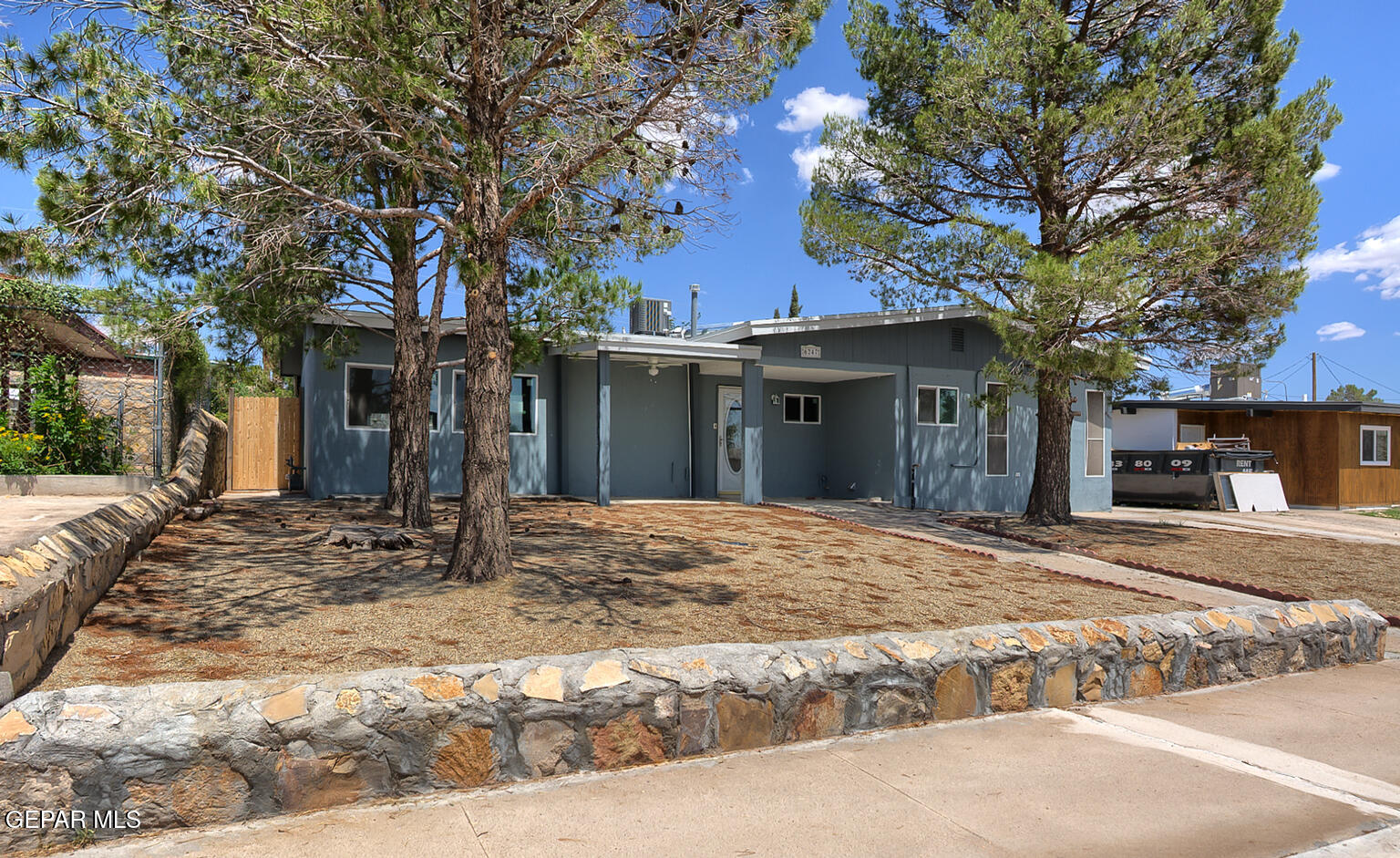 6247 Arapaho Road El Paso, TX 79905 - Photo 3 of 43 a house with trees in front of it