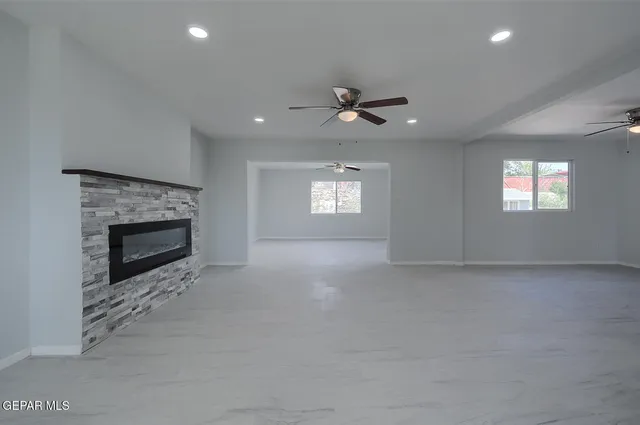 a view closed kitchen island a sink a counter space and a stove top oven
