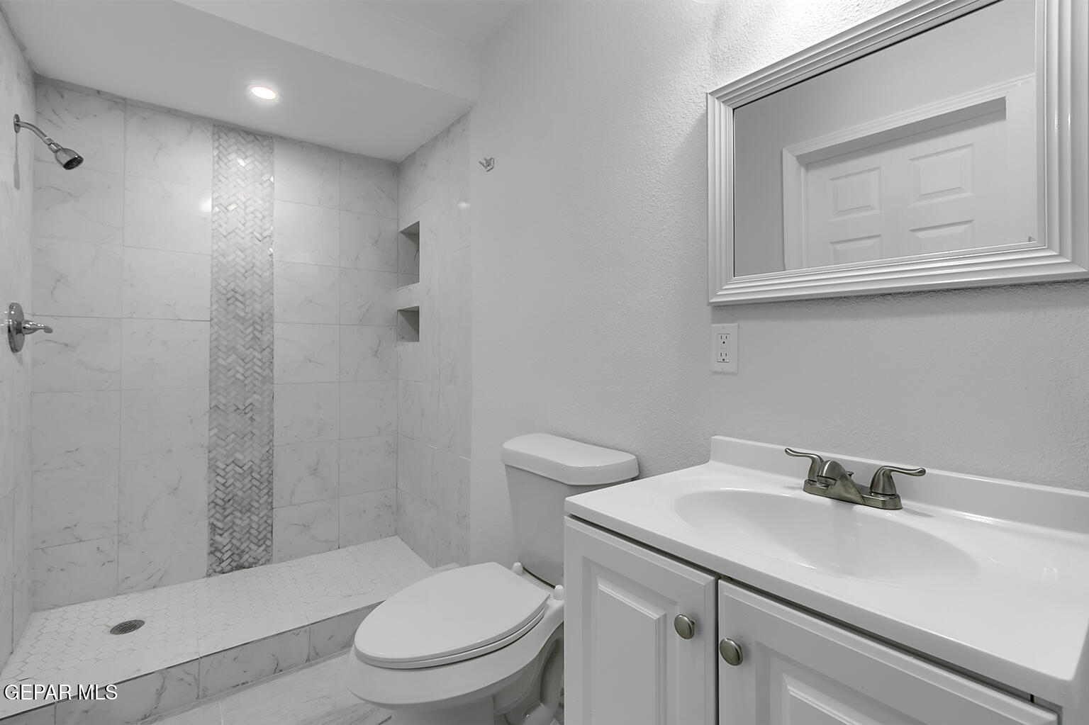 6247 Arapaho Road El Paso, TX 79905 - Photo 30 of 43 a bathroom with a sink a toilet and shower