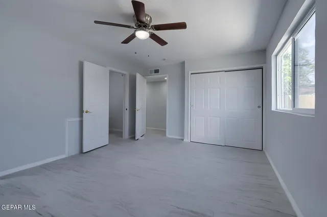 a view of empty room with a fireplace