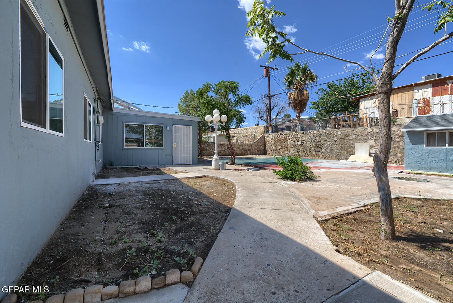 6247 Arapaho Road El Paso, TX 79905 - Photo 38 of 43 a view of a house with a yard