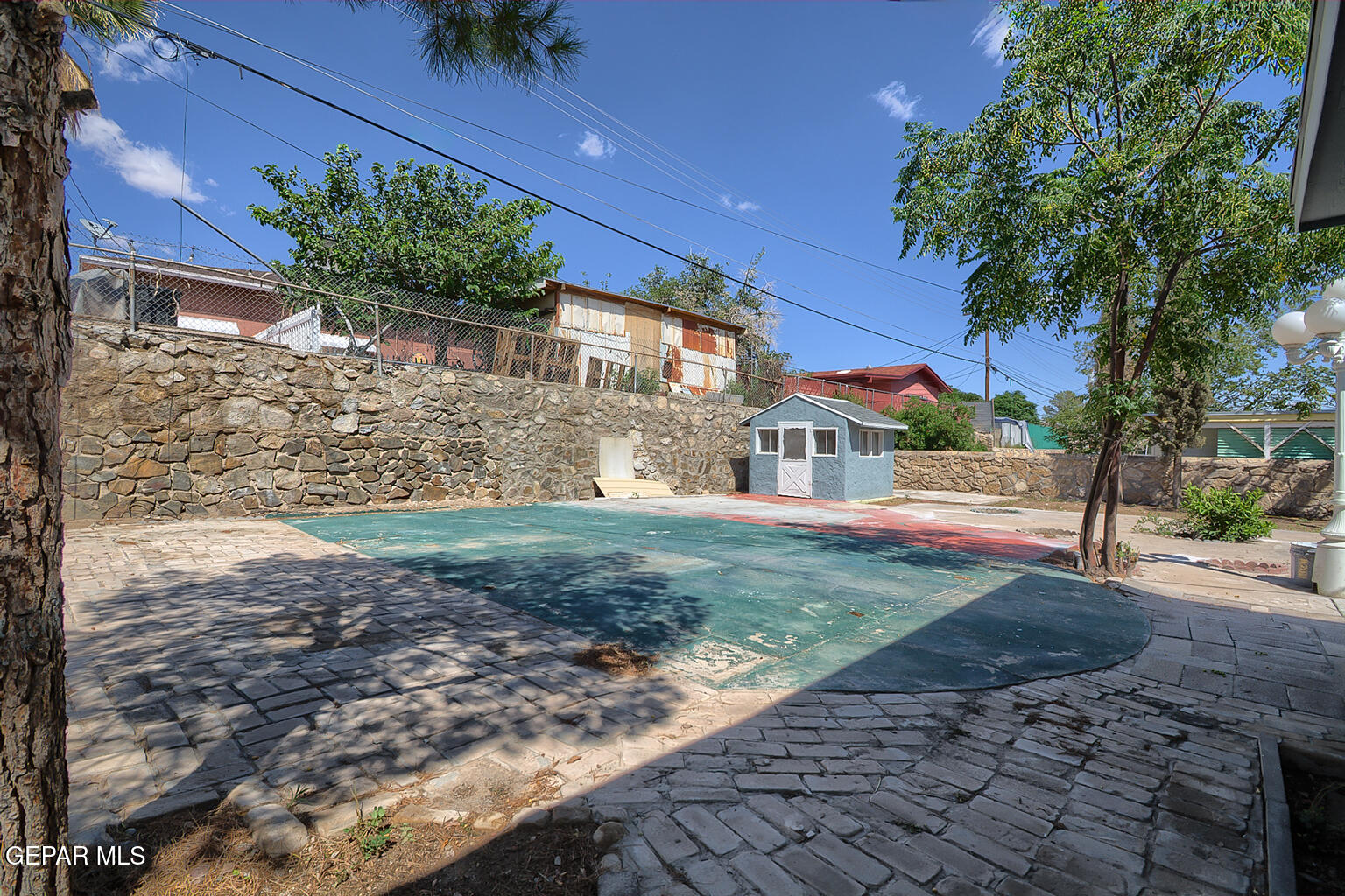 6247 Arapaho Road El Paso, TX 79905 - Photo 39 of 43 a view of a house with a yard