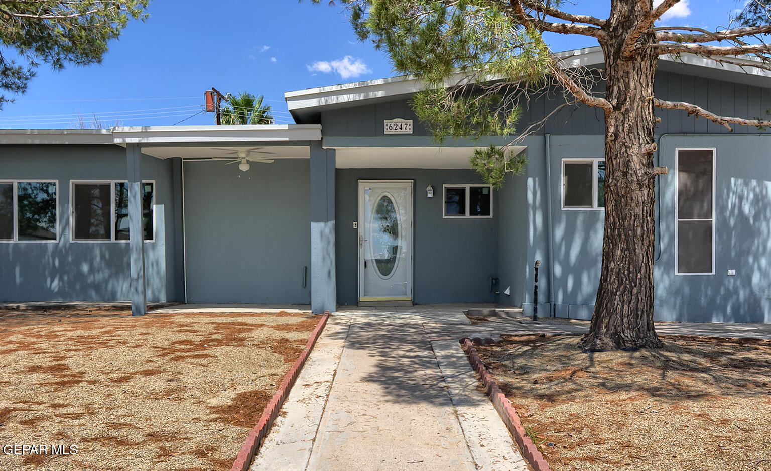 6247 Arapaho Road El Paso, TX 79905 - Photo 5 of 43 a front view of a house with a yard