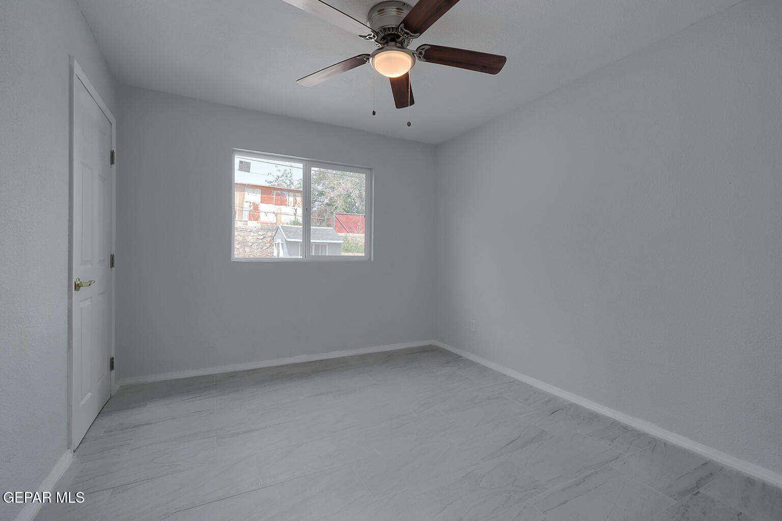 6247 Arapaho Road El Paso, TX 79905 - Photo 8 of 43 an empty room with closet and a window