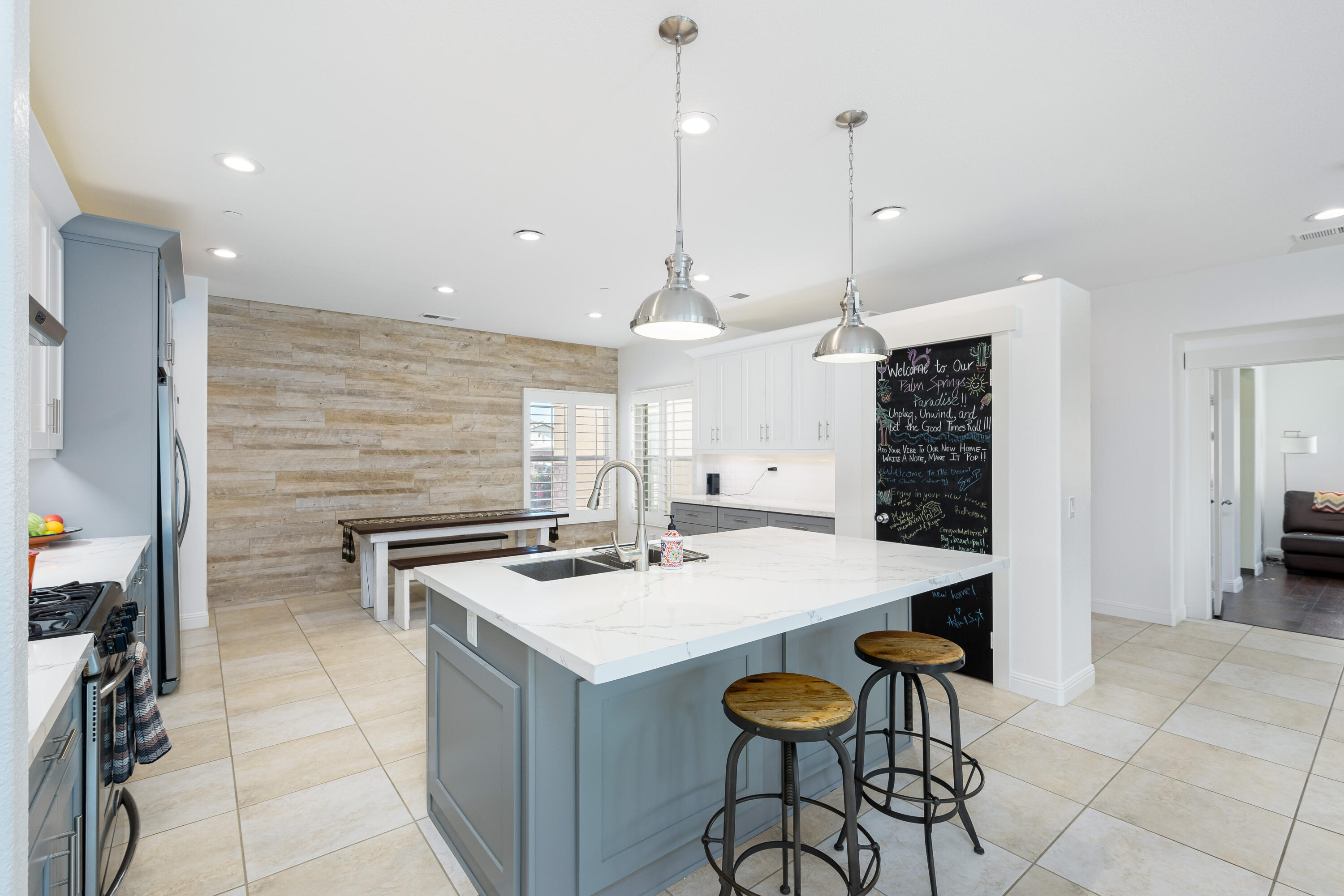 985 Alta Ridge Palm Springs, CA 92262 - Photo 16 of 44 a kitchen with a counter space a sink appliances and cabinets