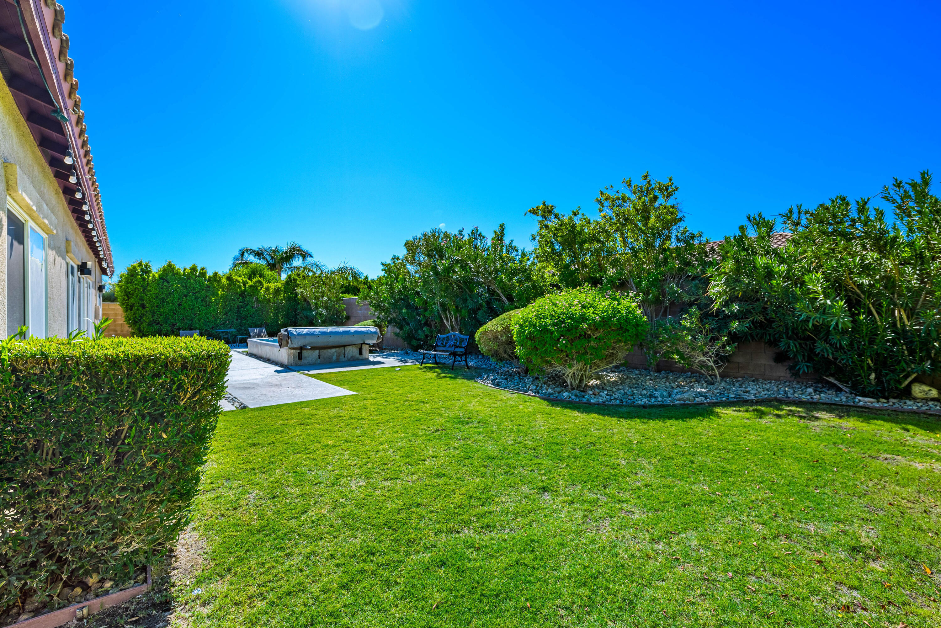 985 Alta Ridge Palm Springs, CA 92262 - Photo 28 of 44 a view of a garden with a fountain