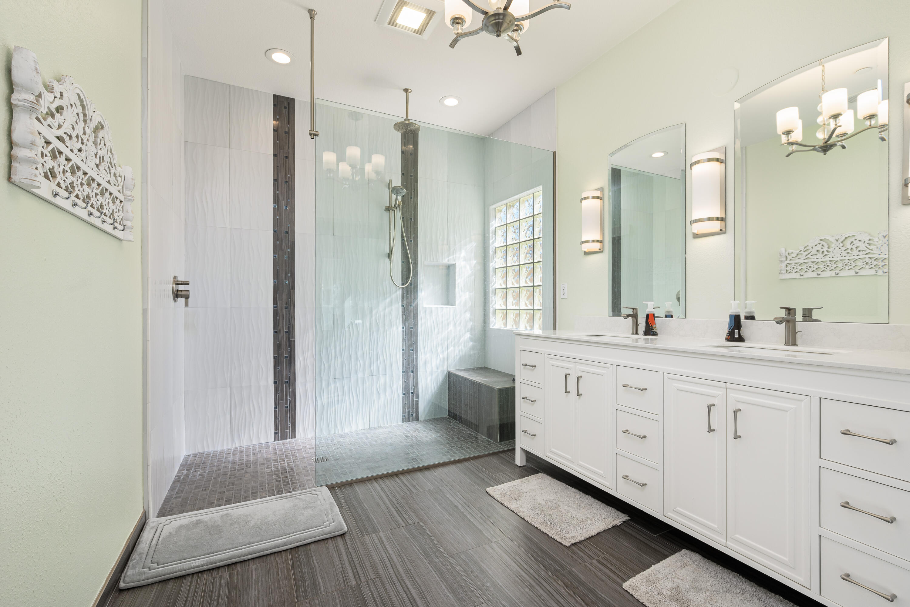 985 Alta Ridge Palm Springs, CA 92262 - Photo 33 of 44 a bathroom with a double vanity sink a toilet a mirror and shower