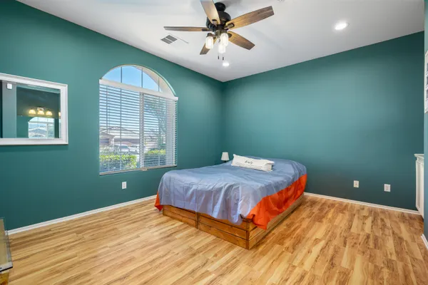 a bedroom with a bed and a window