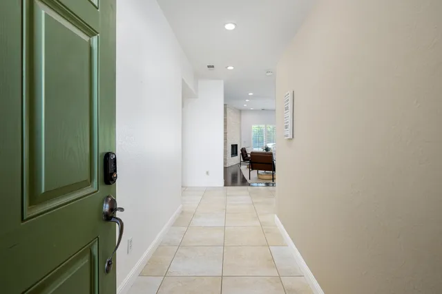 a view of a hallway with furniture