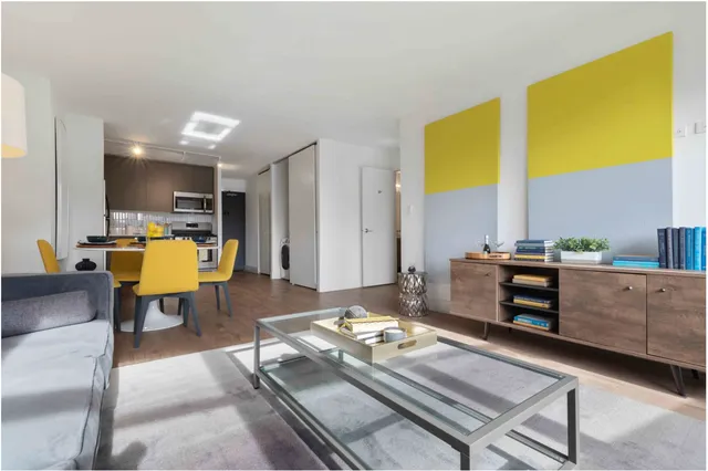 a living room with furniture and a table