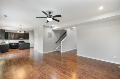 a view of a kitchen with a sink and a stove top oven