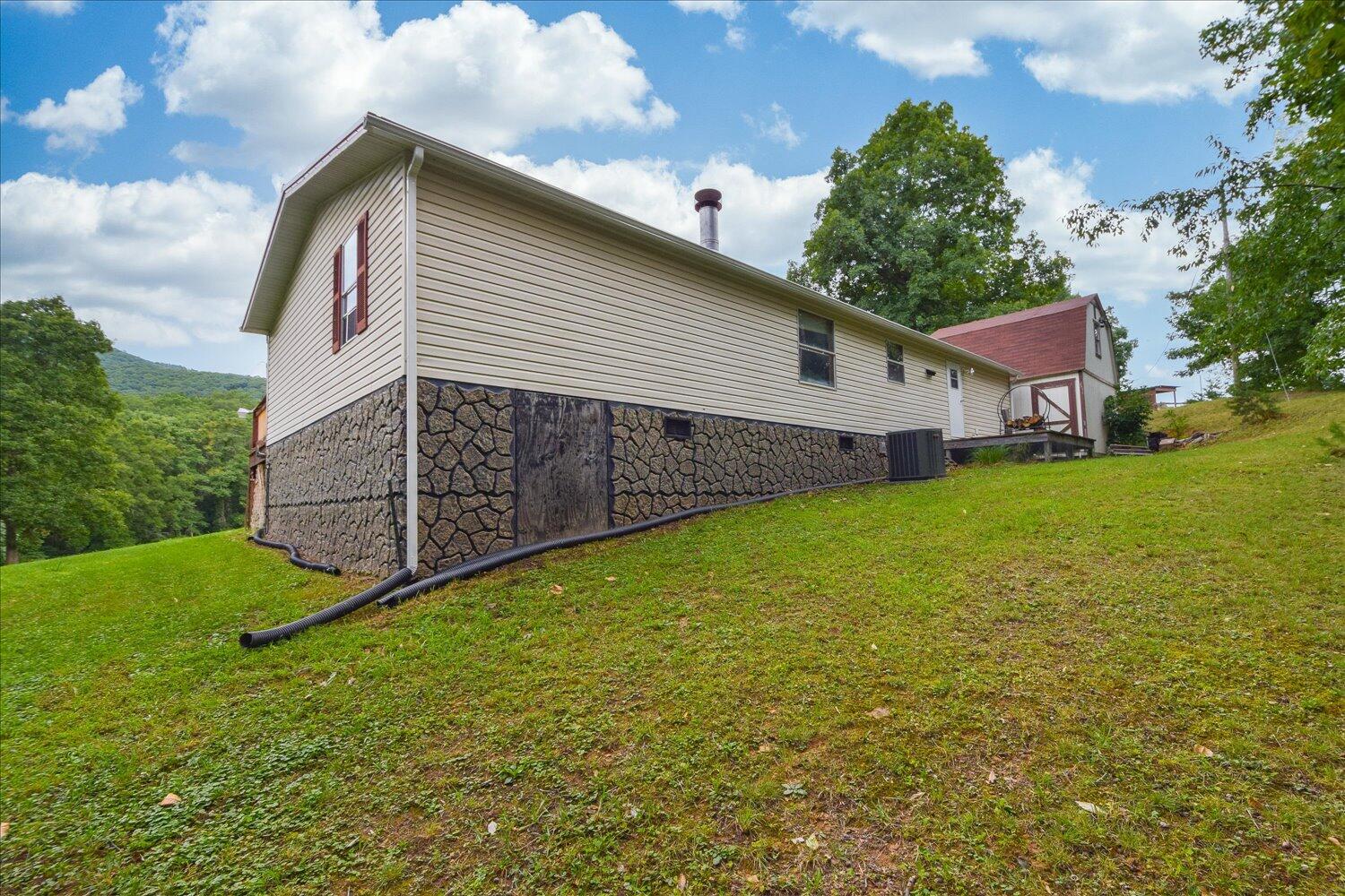 6423 Meacham Road Salem, VA 24153 - Photo 21 of 29 a view of a backyard with a garden