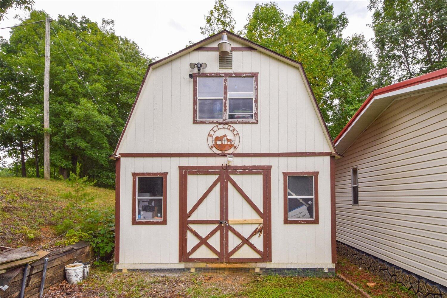 6423 Meacham Road Salem, VA 24153 - Photo 23 of 29 a front view of a house with garden