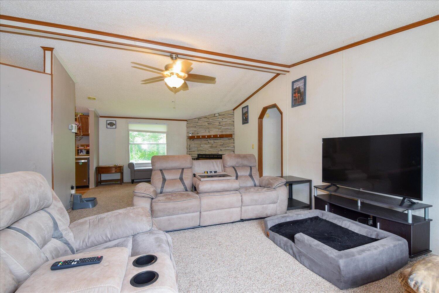 6423 Meacham Road Salem, VA 24153 - Photo 5 of 29 a living room with furniture and a flat screen tv