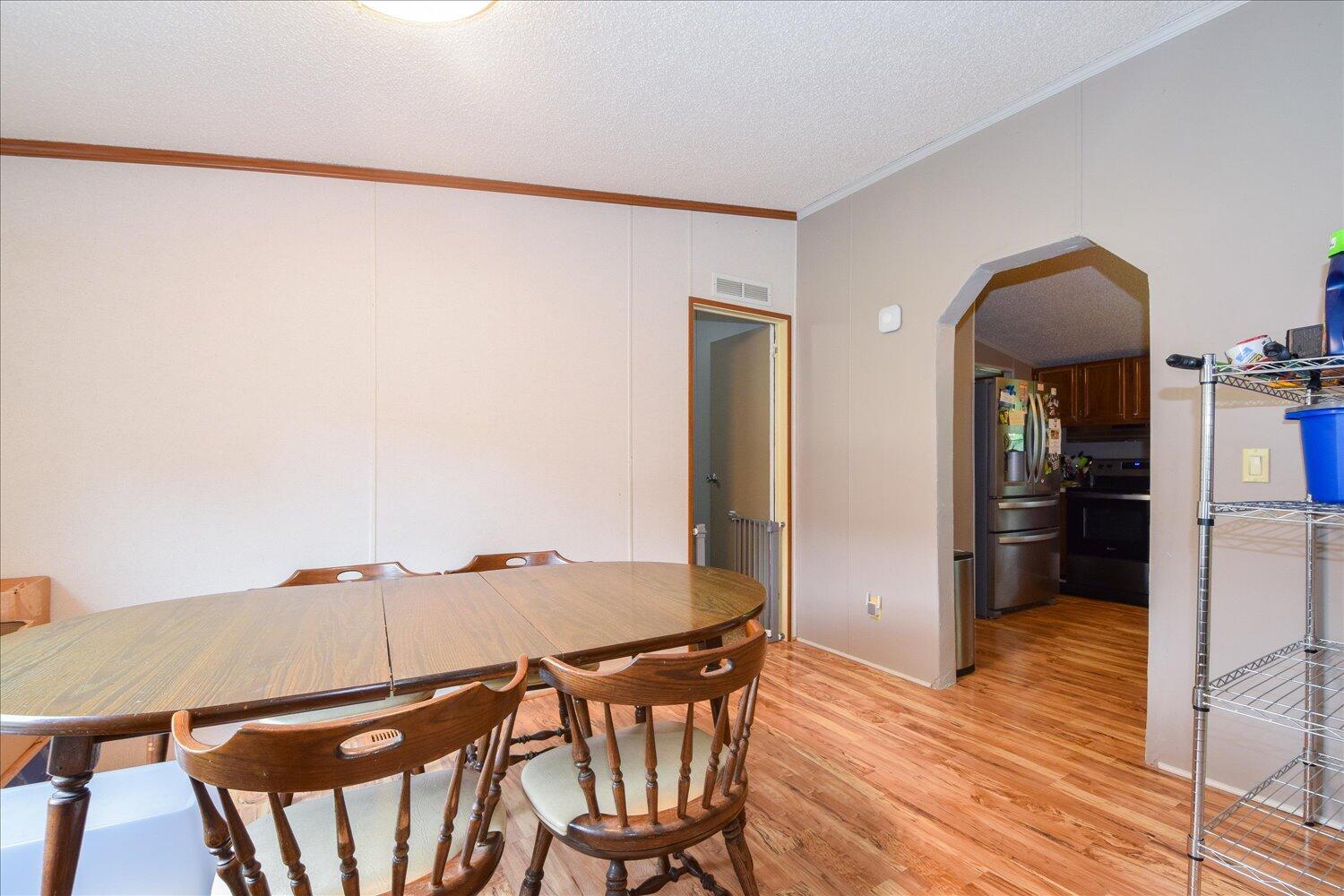 6423 Meacham Road Salem, VA 24153 - Photo 6 of 29 a view of a dining room with furniture and wooden floor