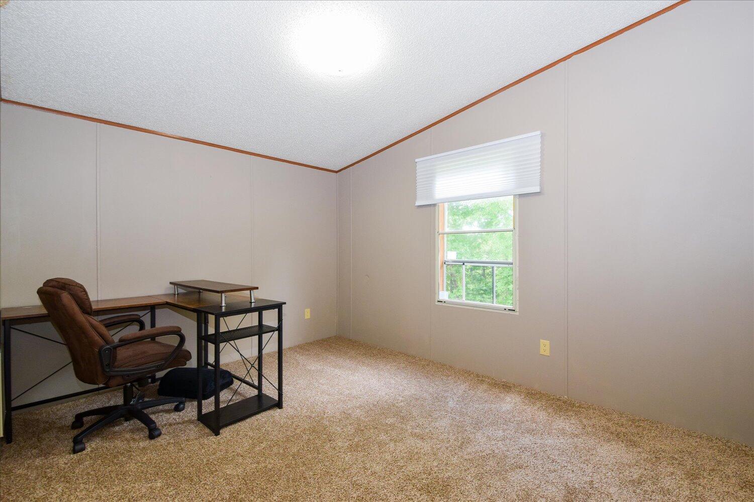 6423 Meacham Road Salem, VA 24153 - Photo 10 of 29 a workspace with furniture and a window