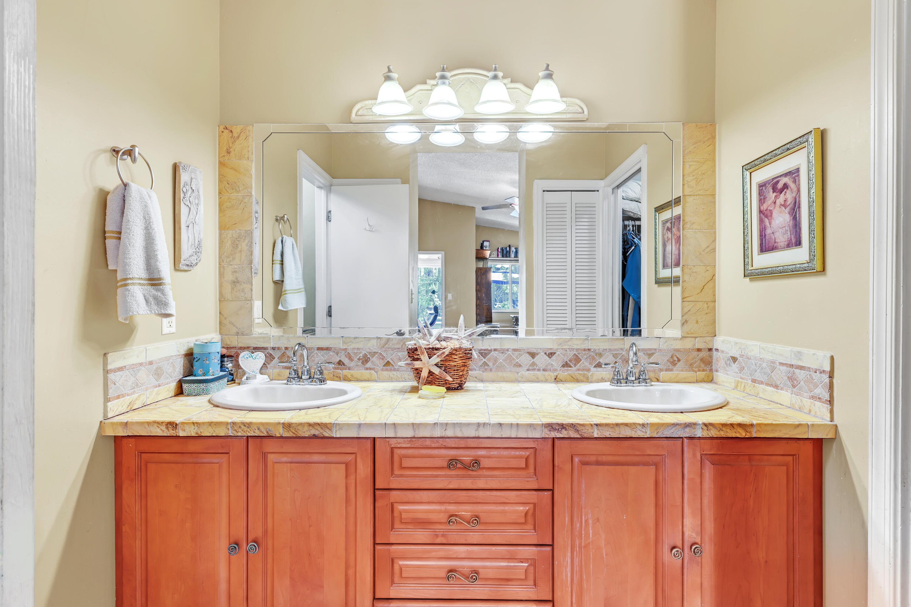 1440 Southwest 20th Street Boca Raton, FL 33486 - Photo 12 of 45 a bathroom with a granite countertop sink and a mirror