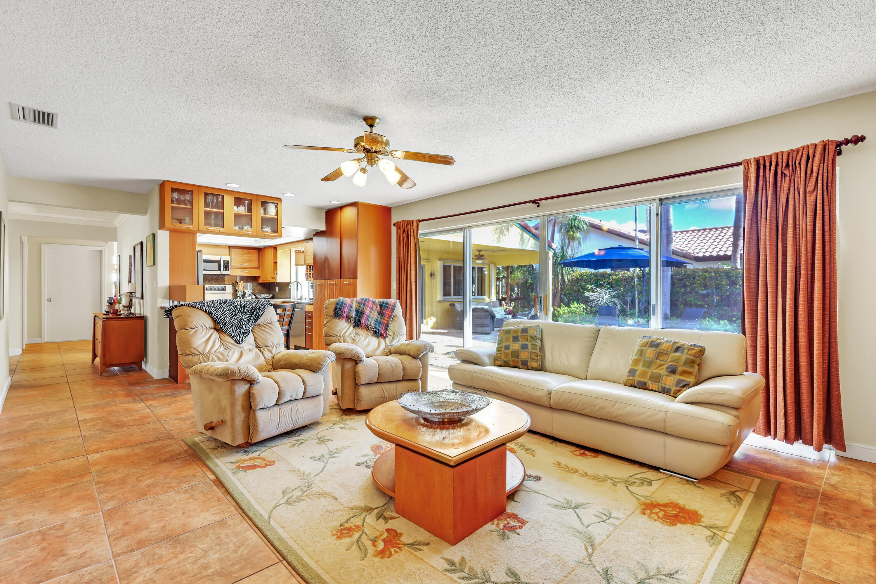 1440 Southwest 20th Street Boca Raton, FL 33486 - Photo 20 of 45 a living room with furniture ceiling fan and a large window