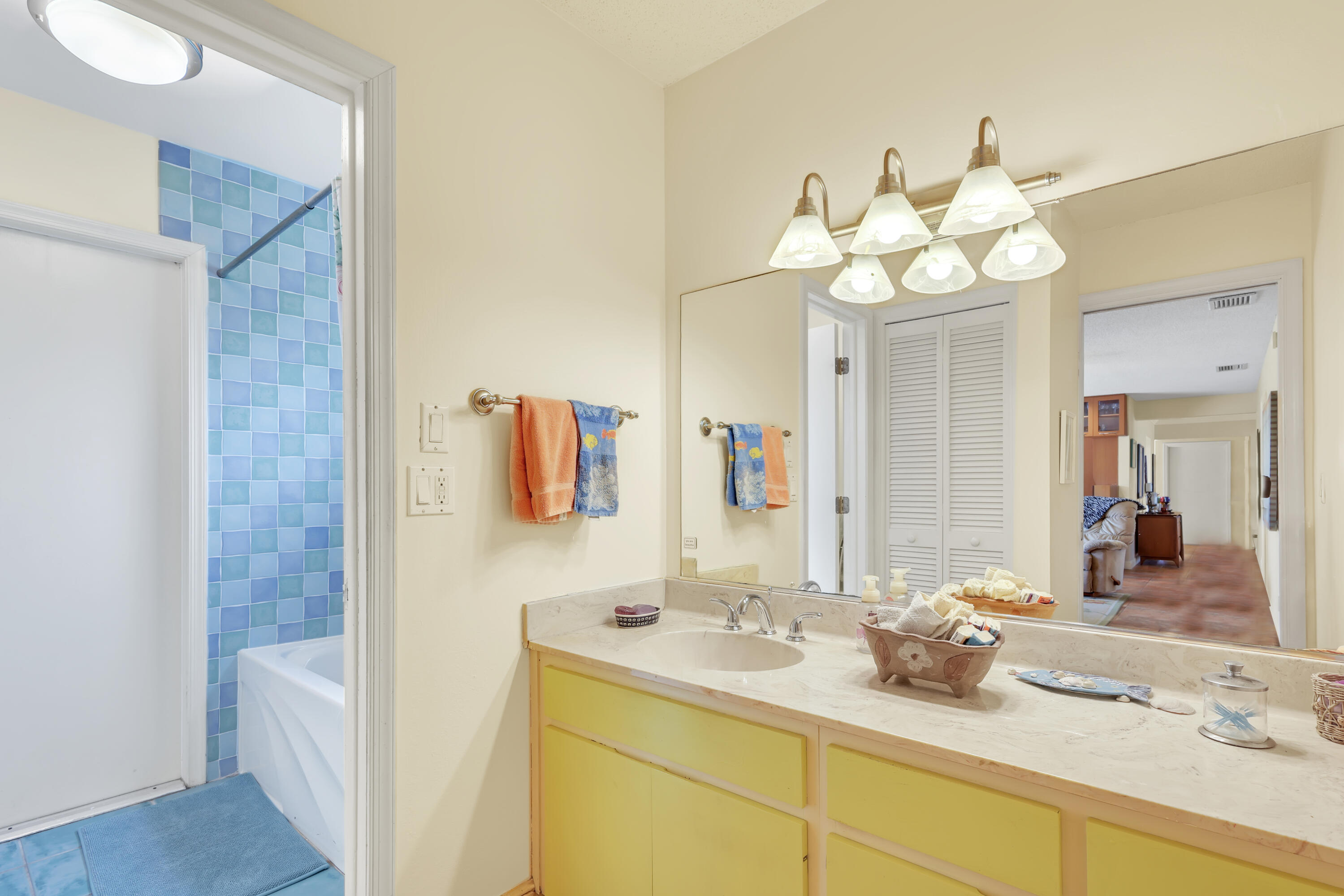 1440 Southwest 20th Street Boca Raton, FL 33486 - Photo 21 of 45 a bathroom with a sink mirror and vanity