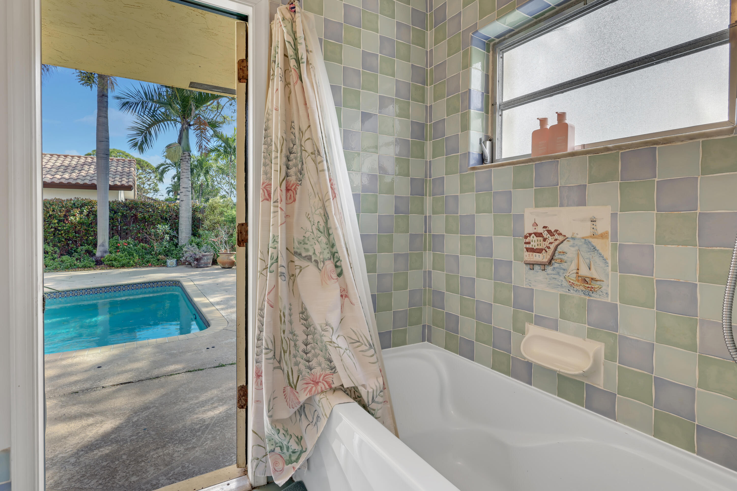 1440 Southwest 20th Street Boca Raton, FL 33486 - Photo 22 of 45 a bathroom with a bathtub