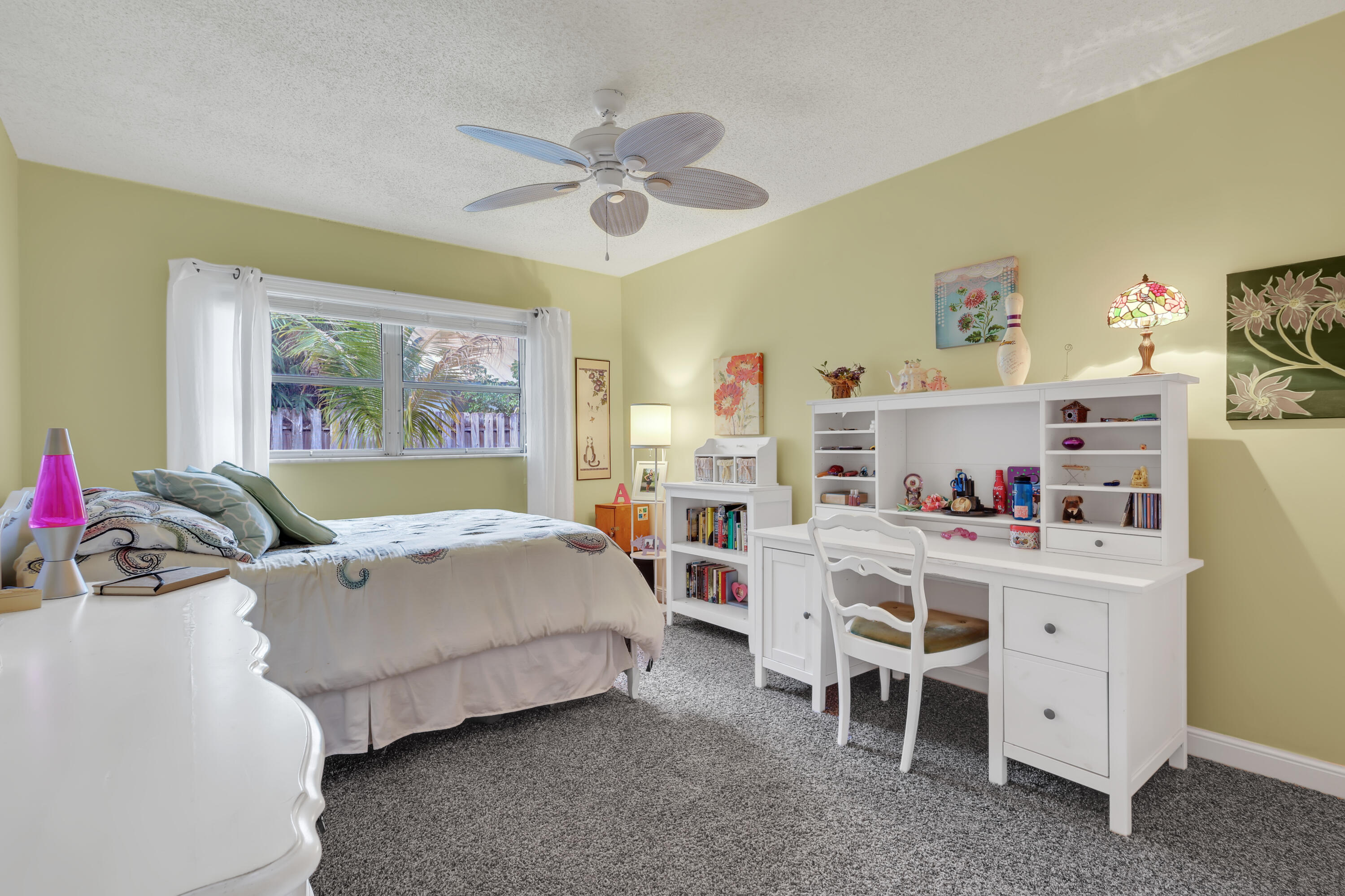 1440 Southwest 20th Street Boca Raton, FL 33486 - Photo 24 of 45 a bed room with a bed and a window