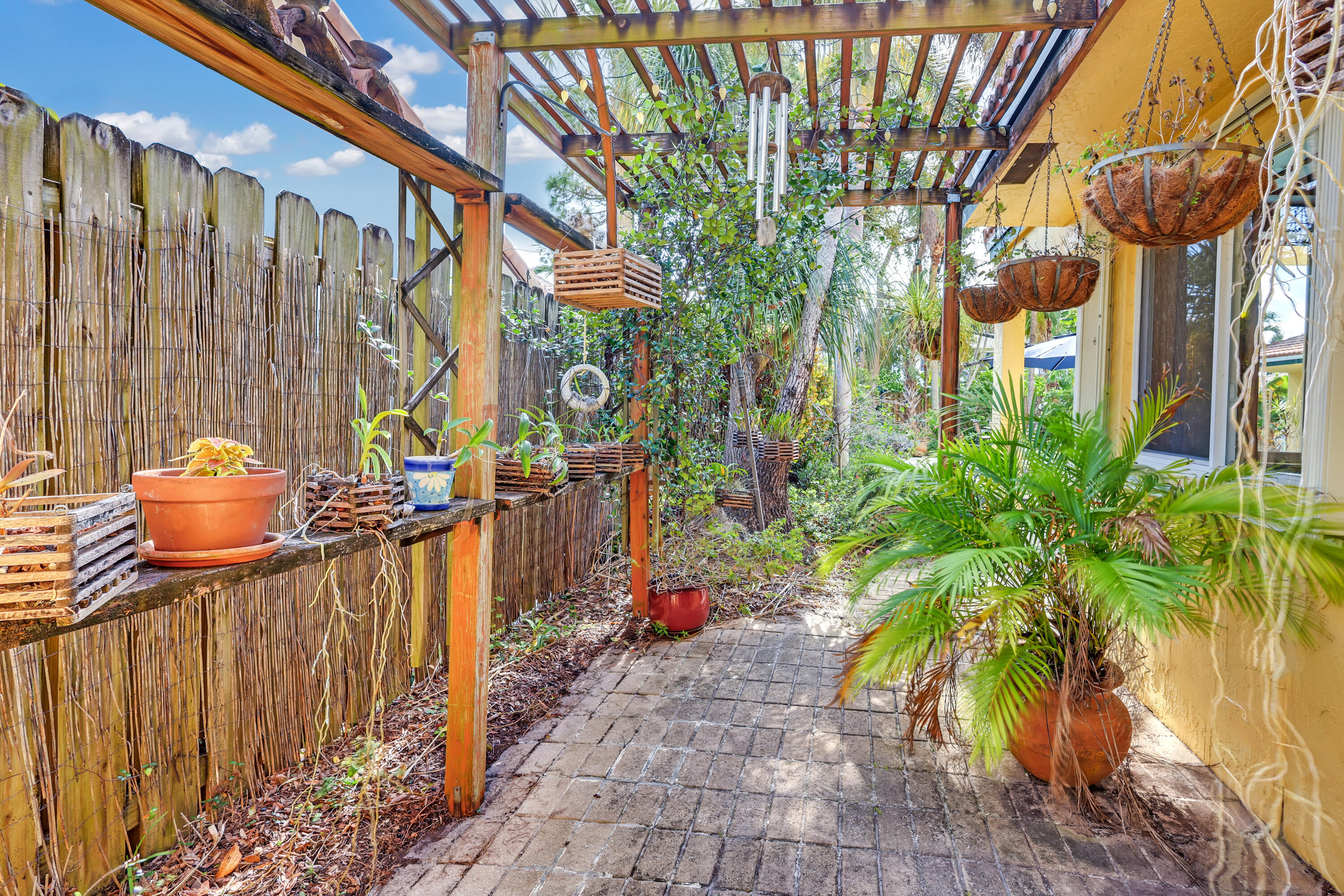 1440 Southwest 20th Street Boca Raton, FL 33486 - Photo 32 of 45 a view of a pathway of a patio with a fountain