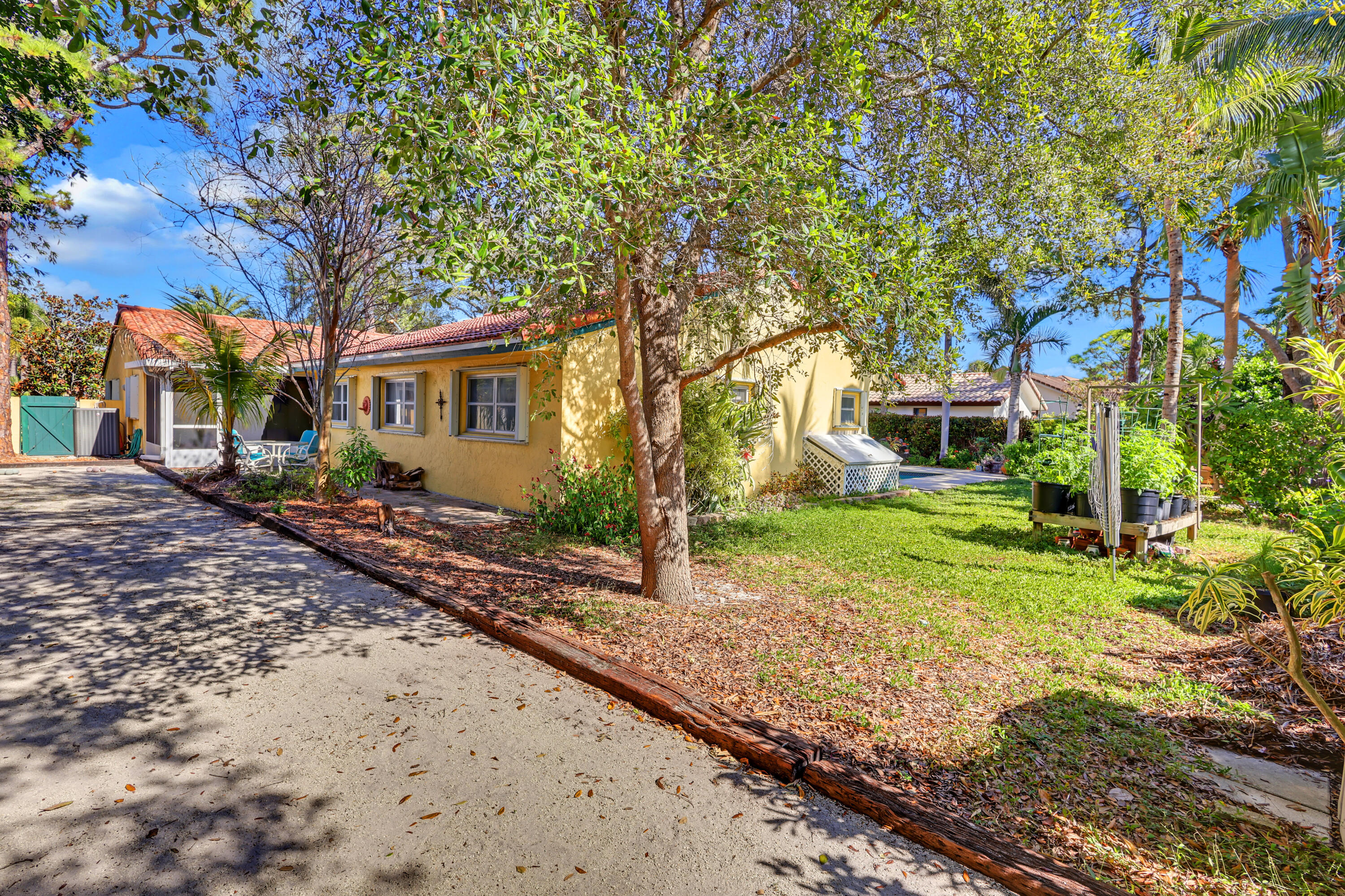1440 Southwest 20th Street Boca Raton, FL 33486 - Photo 34 of 45 a view of a yard with plants and trees