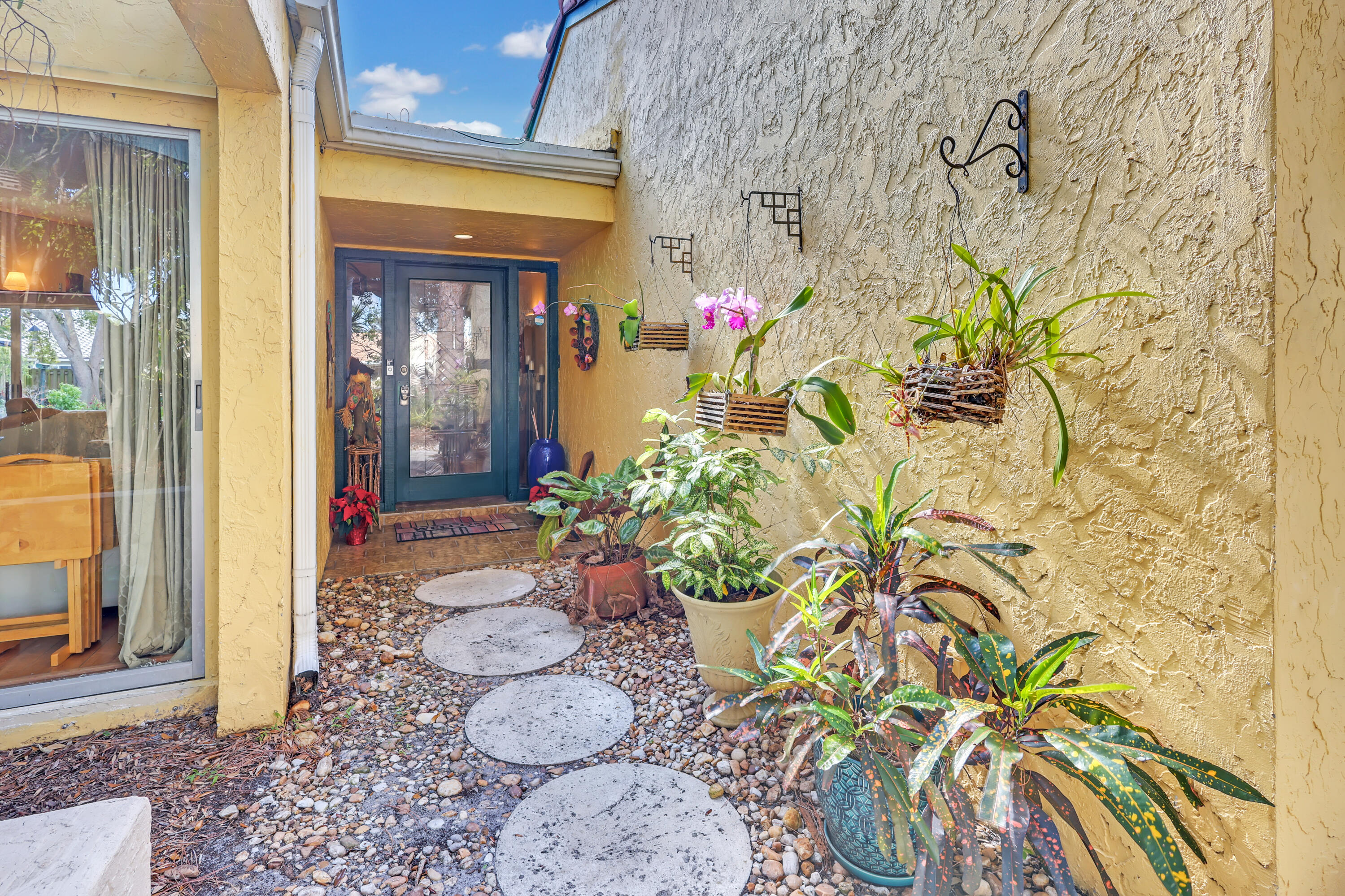 1440 Southwest 20th Street Boca Raton, FL 33486 - Photo 40 of 45 a vase of flowers sitting on a floor