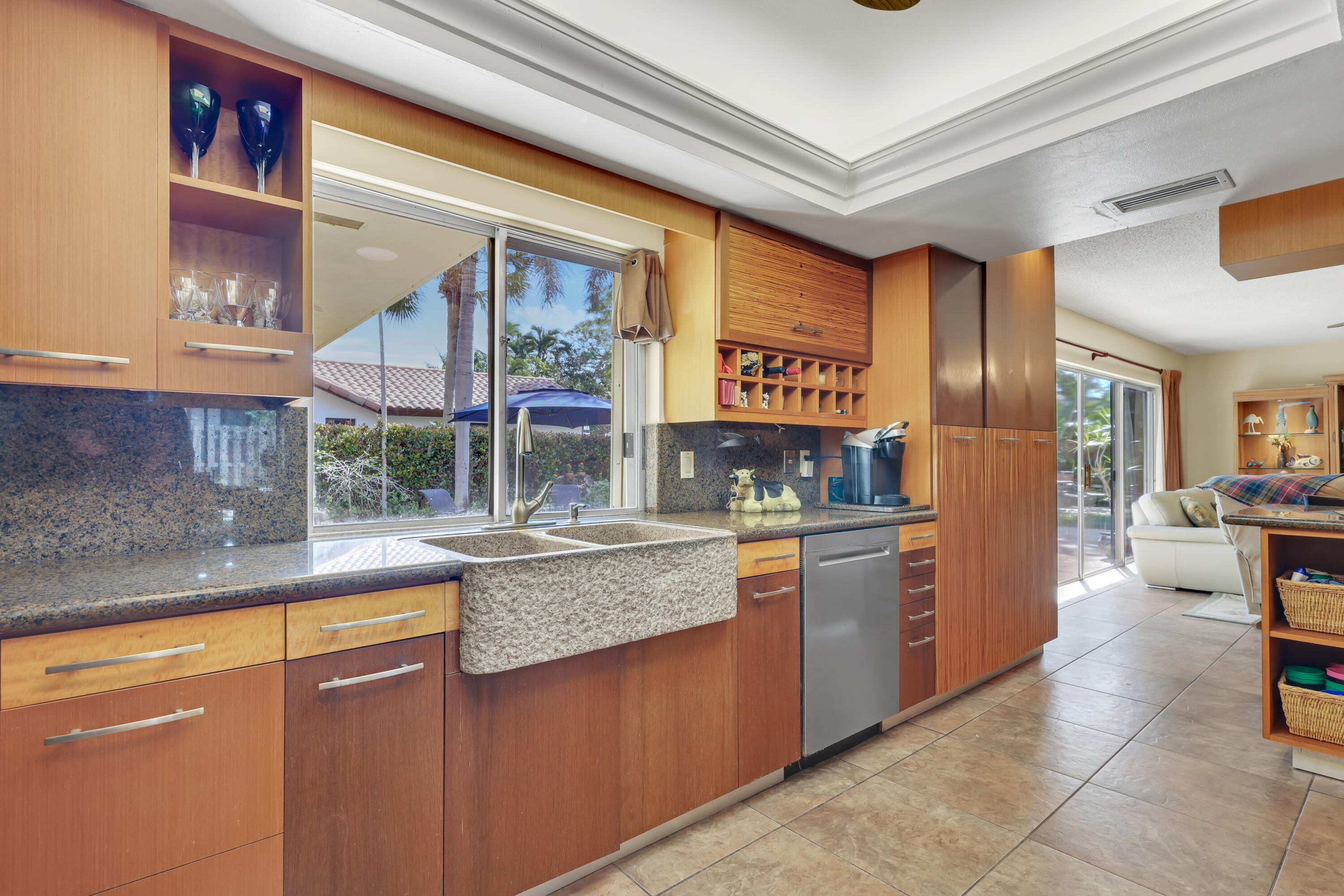 1440 Southwest 20th Street Boca Raton, FL 33486 - Photo 5 of 45 a kitchen with stainless steel appliances granite countertop a refrigerator a stove and a sink with cabinets