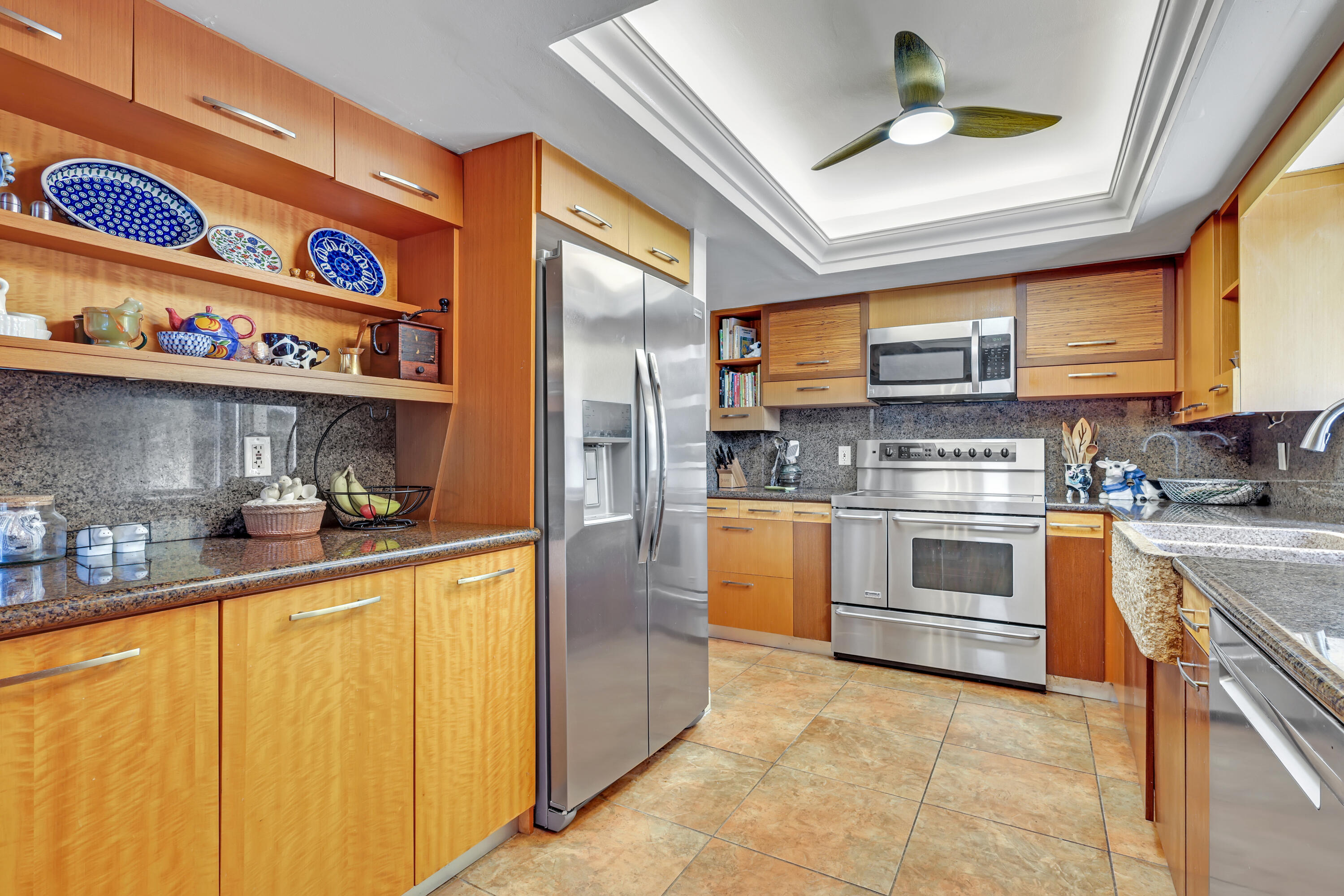 1440 Southwest 20th Street Boca Raton, FL 33486 - Photo 7 of 45 a kitchen with stainless steel appliances granite countertop a stove and a refrigerator