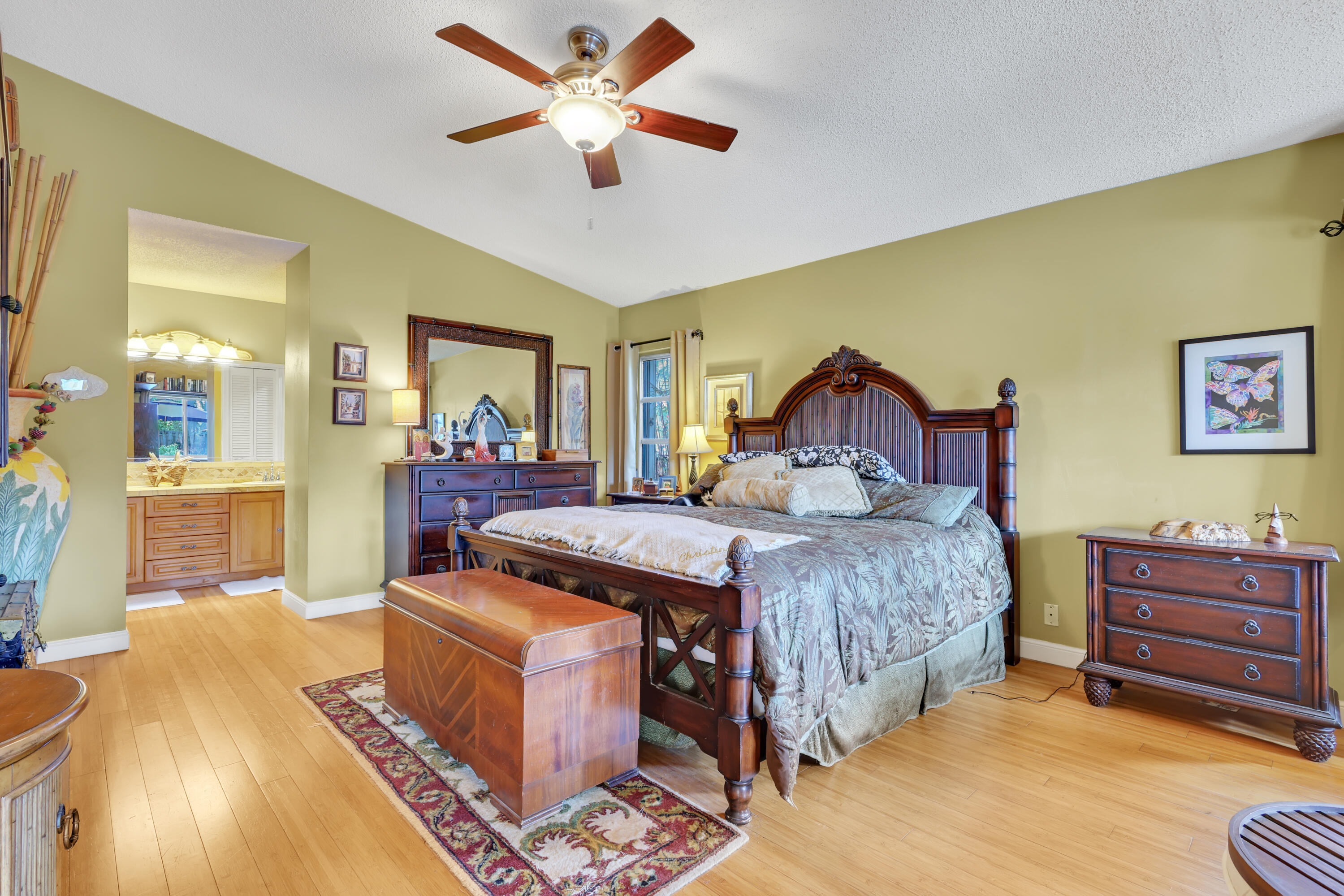 1440 Southwest 20th Street Boca Raton, FL 33486 - Photo 10 of 45 a bedroom with a bed and wooden floor