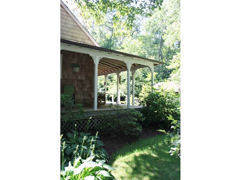 27 Mill Pond Road Exeter, RI 02822 - Photo 12 of 18 Exterior Back. Enjoy peace and quiet on the wrap-around porch.