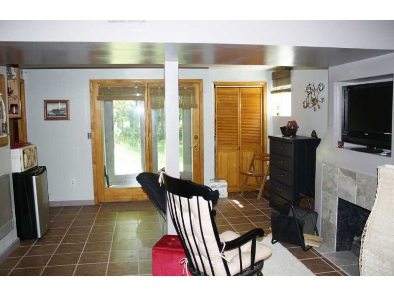 27 Mill Pond Road Exeter, RI 02822 - Photo 10 of 18 Cellar or Basement. Walkout basement family room with gas fireplace.