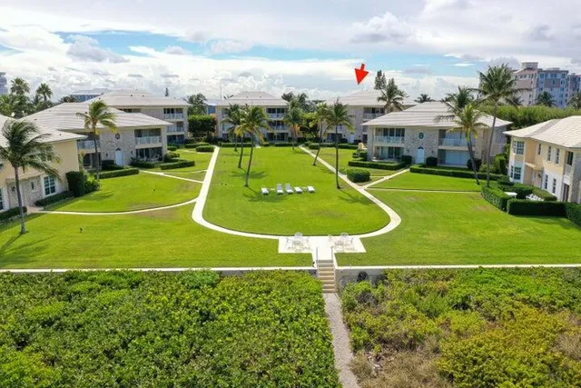an aerial view of a house with a swimming pool