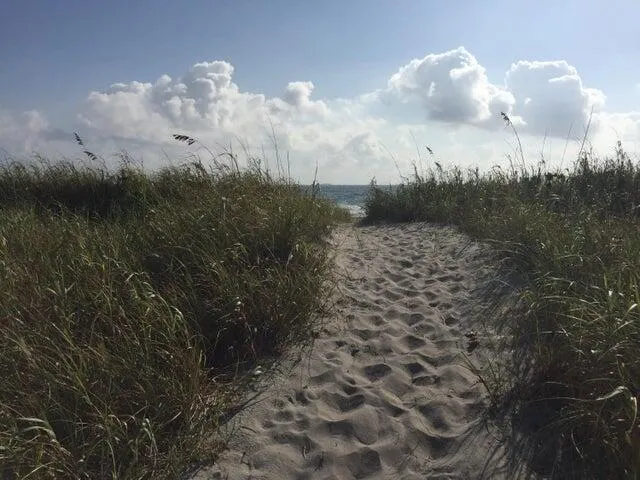 a bedroom with a bed and a chair