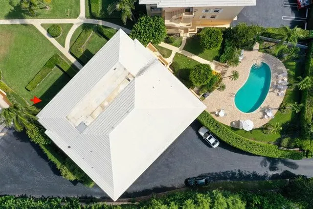 a view of a swimming pool with a patio