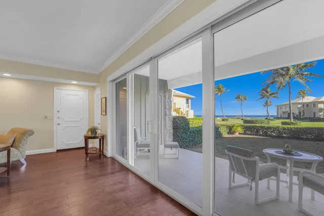 a view of a livingroom with furniture and front door