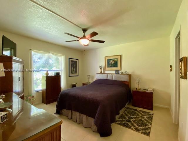 Brickell Miami, FL 33129 - Photo 15 of 24 a bedroom with a large bed and a chandelier
