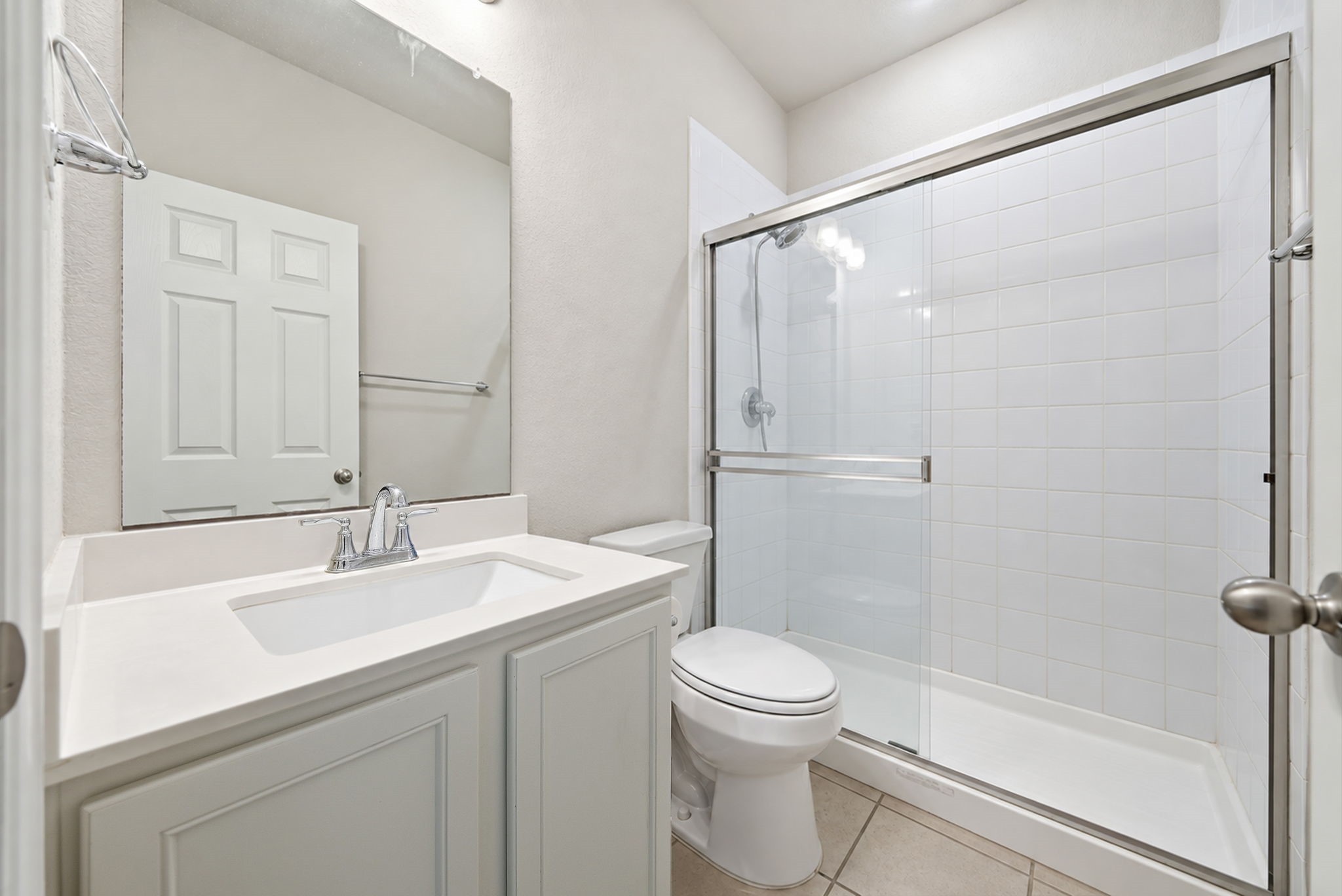 17714 Sugar Magnolia Lane Spring, TX 77379 - Photo 16 of 24 Full bath with a walk-in glass shower and a clean, neutral finish.