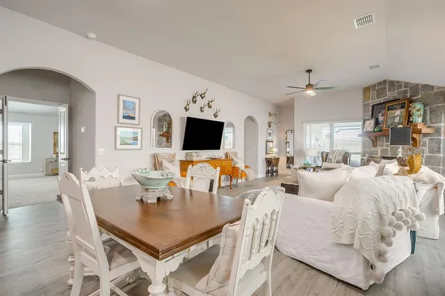 a living room with fireplace furniture and a flat screen tv
